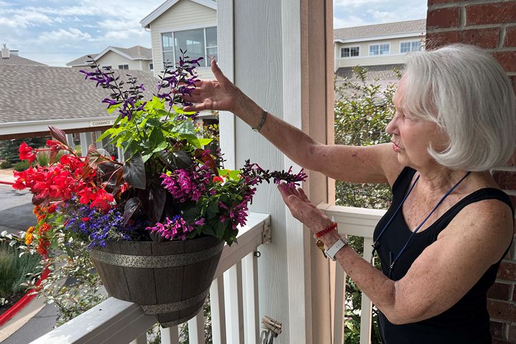 holly creek resident tending to planter